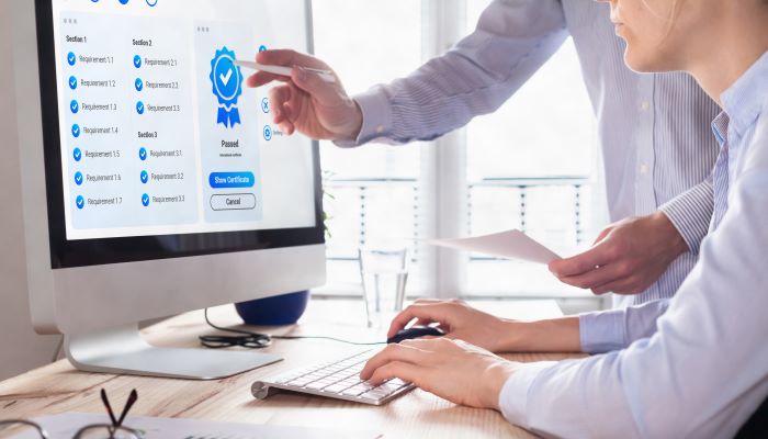 Man explaining information on computer screen